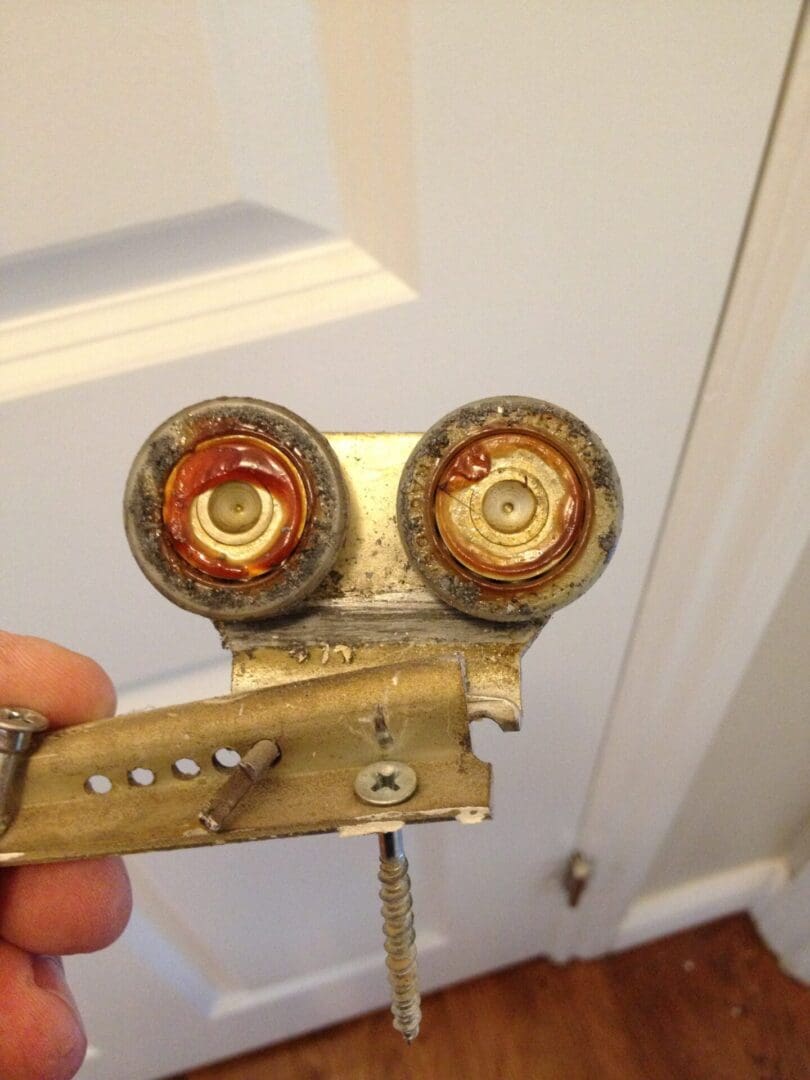 A person holding up an old camera with two lens.