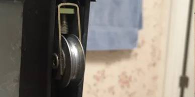 A close up of the door handle on a window