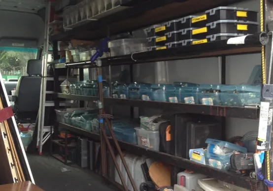 A room filled with lots of shelves and boxes.